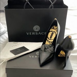 Black Versace pumps. New. Size 7.5 comes with box, tags and duster!